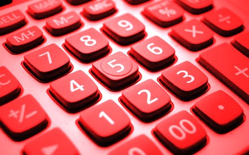 Red calculator keypad highlighting key numbers, relevant to key person insurance calculations and coverage assessments.