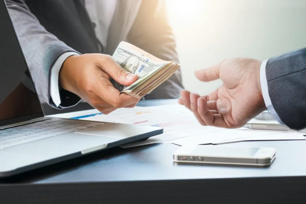 Two people looking over a loan agreement