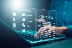 keyboard with hand typing out insurance 